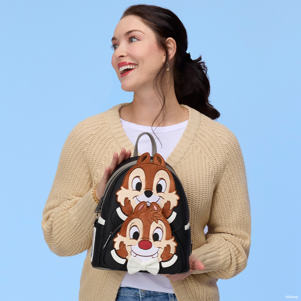 Blue background with model holding Chip N Dale Loungefly bag